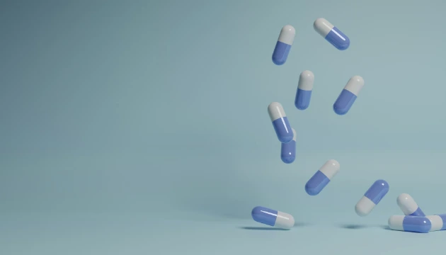a group of pills falling into the air